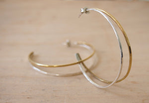 Large hoop earrings in silver and brass