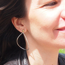 Load image into Gallery viewer, Variable Teardrop hoops in silver and brass