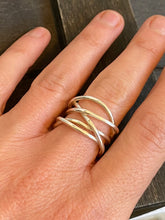 Load image into Gallery viewer, The large silver tangle ring shown worn