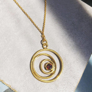 "Three Faces Of The Moon" Pendant in gold plated silver with red garnet