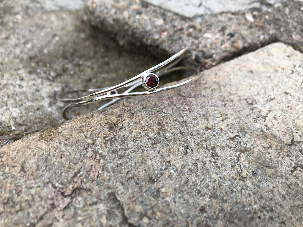 Silver wave bracelet with red garnets