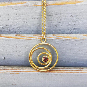 "Three Faces Of The Moon" Pendant in gold plated silver with red garnet