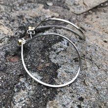 Load image into Gallery viewer, Variable Teardrop hoops in silver and brass