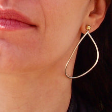 Load image into Gallery viewer, Variable Teardrop hoops in silver and brass