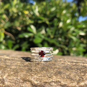 Silver wave ring with red garnet