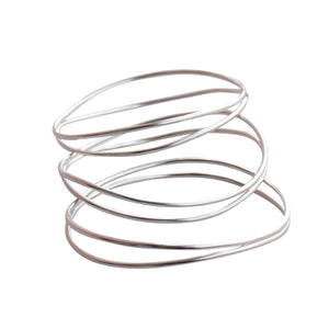 a picture of three silver wave bracelets on a white background